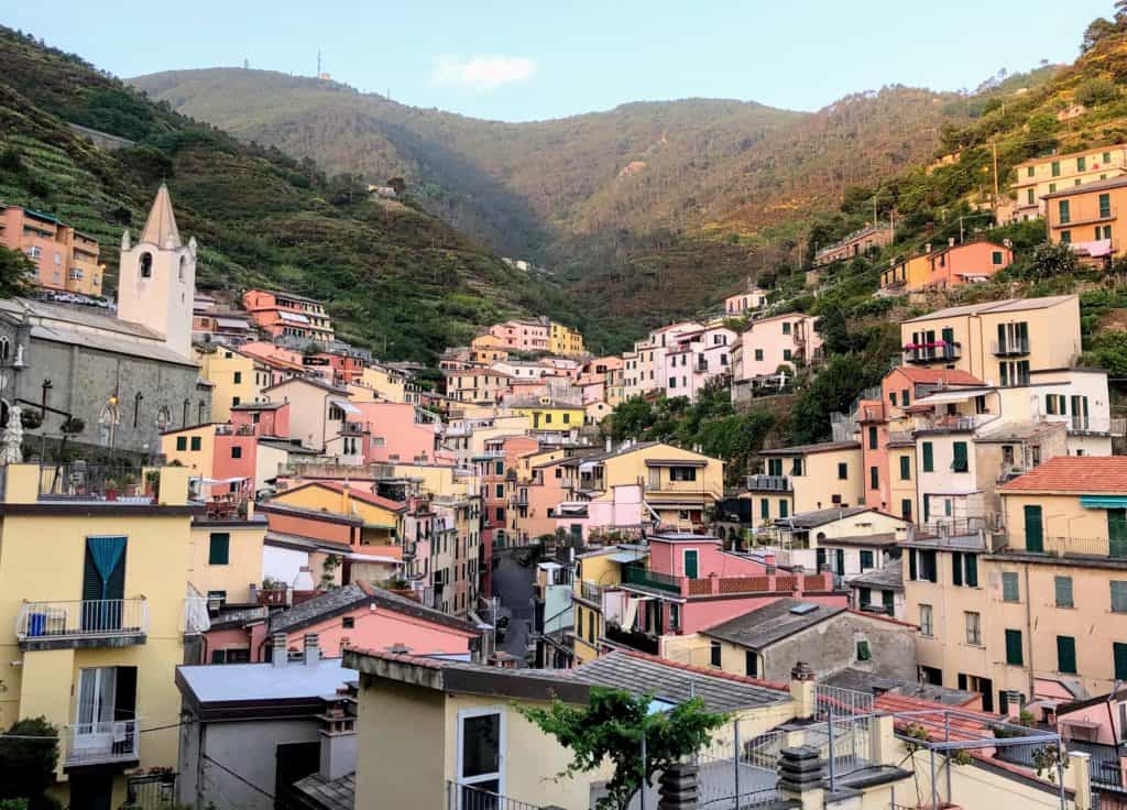 Cinque Terre Riomaggiore Town View Of Hills And Church San Giovanni Battista Pastel Pink Houses