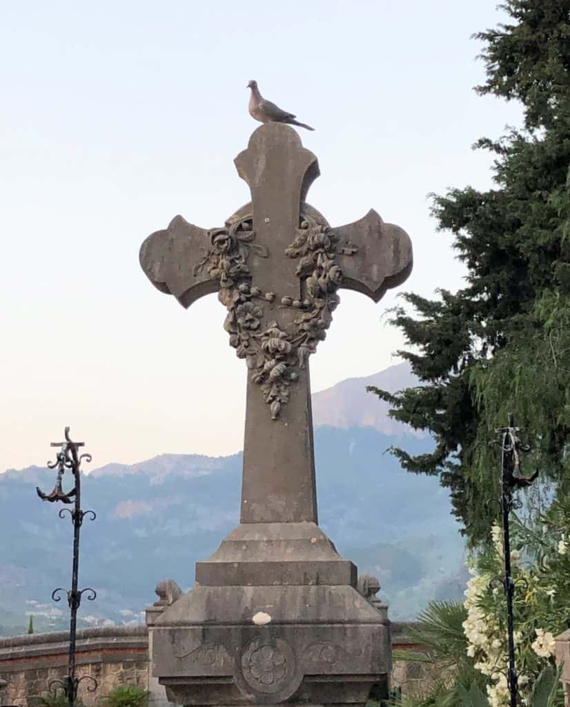 Soller Mallorca Cemetery Bird On Stone Cross With Art Nouveau Carvings Tramuntana Mountains And Trees