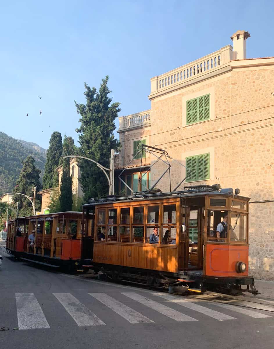 Soller Mallorca Orange Tram With Stone Buildings And Trees