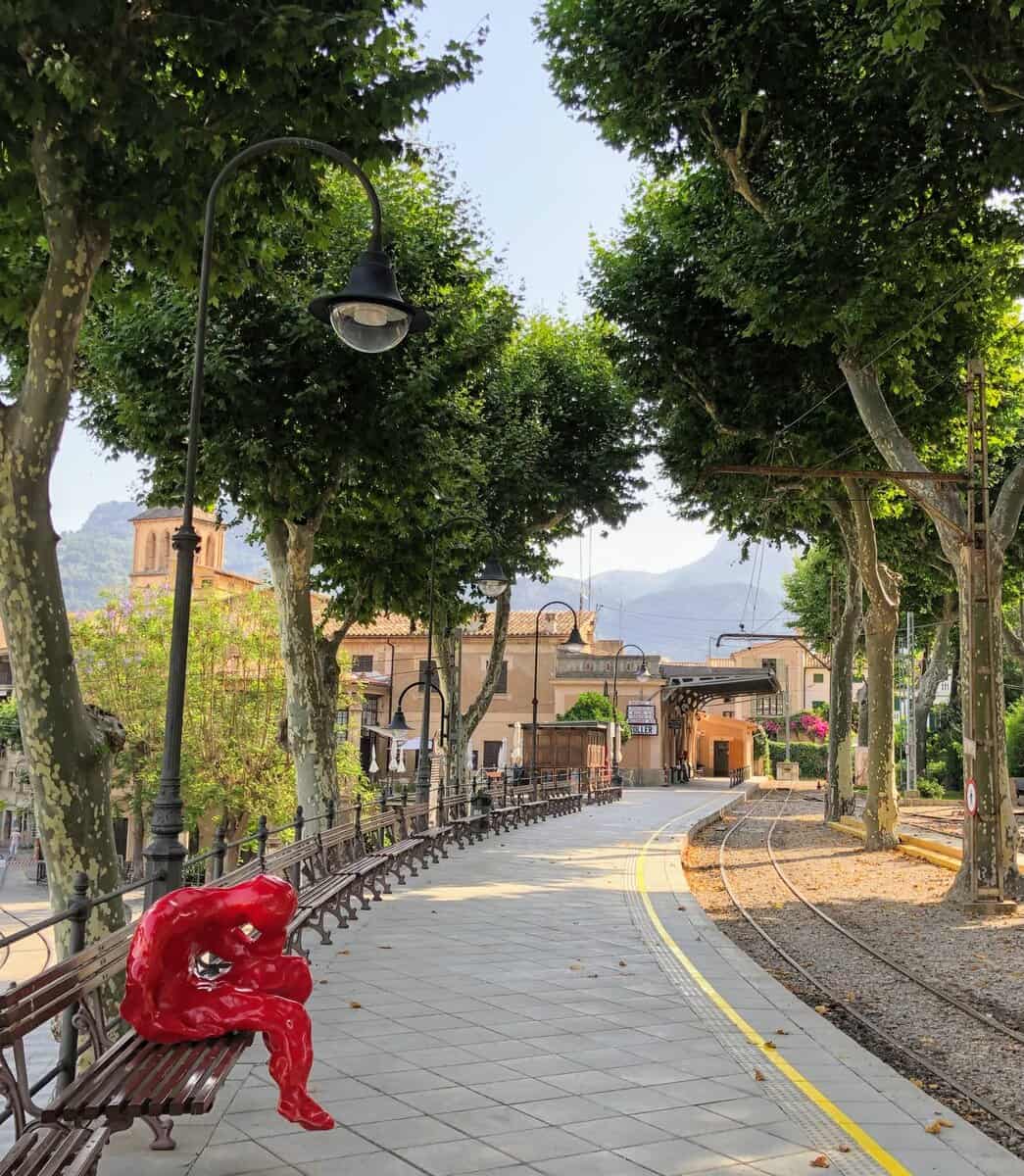 Soller Mallorca Tramuntana Mountains Train Station With Red Sculpture On Bench