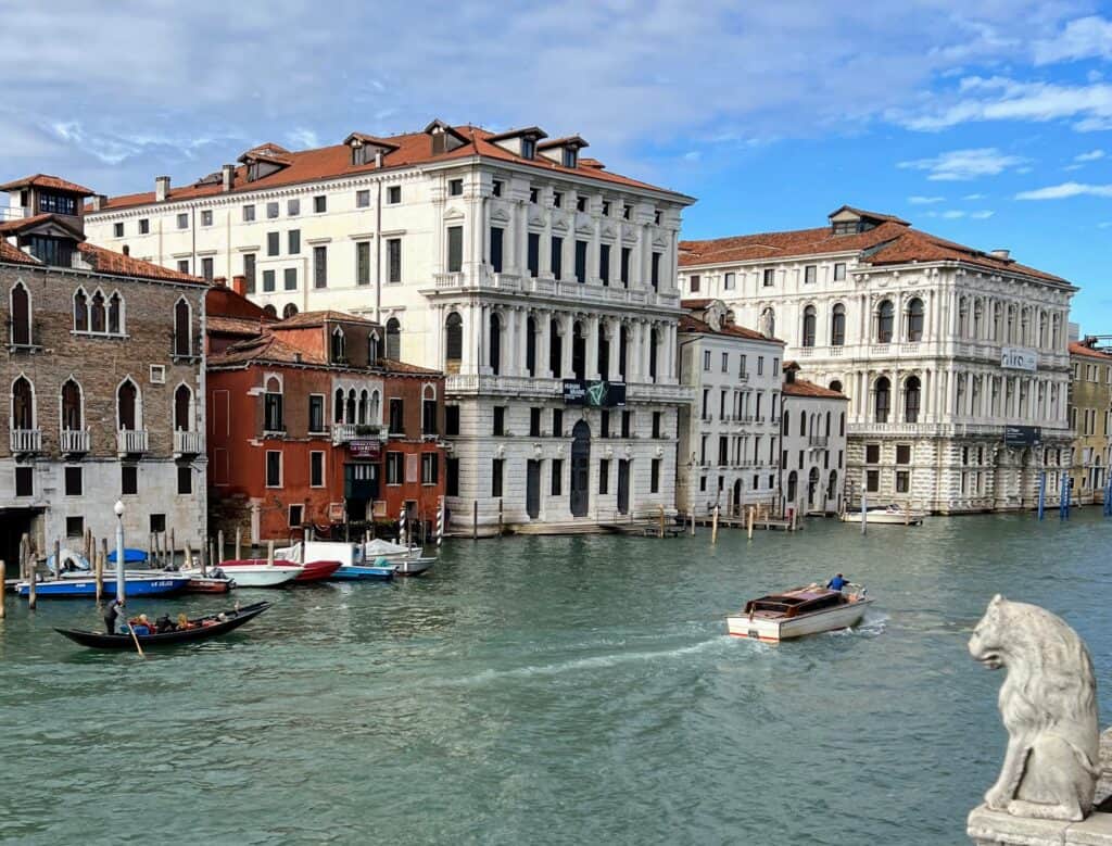 Venice Palazzo Ca Corner Della Regina View From Across Grand Canal With Lion Statue And Boats