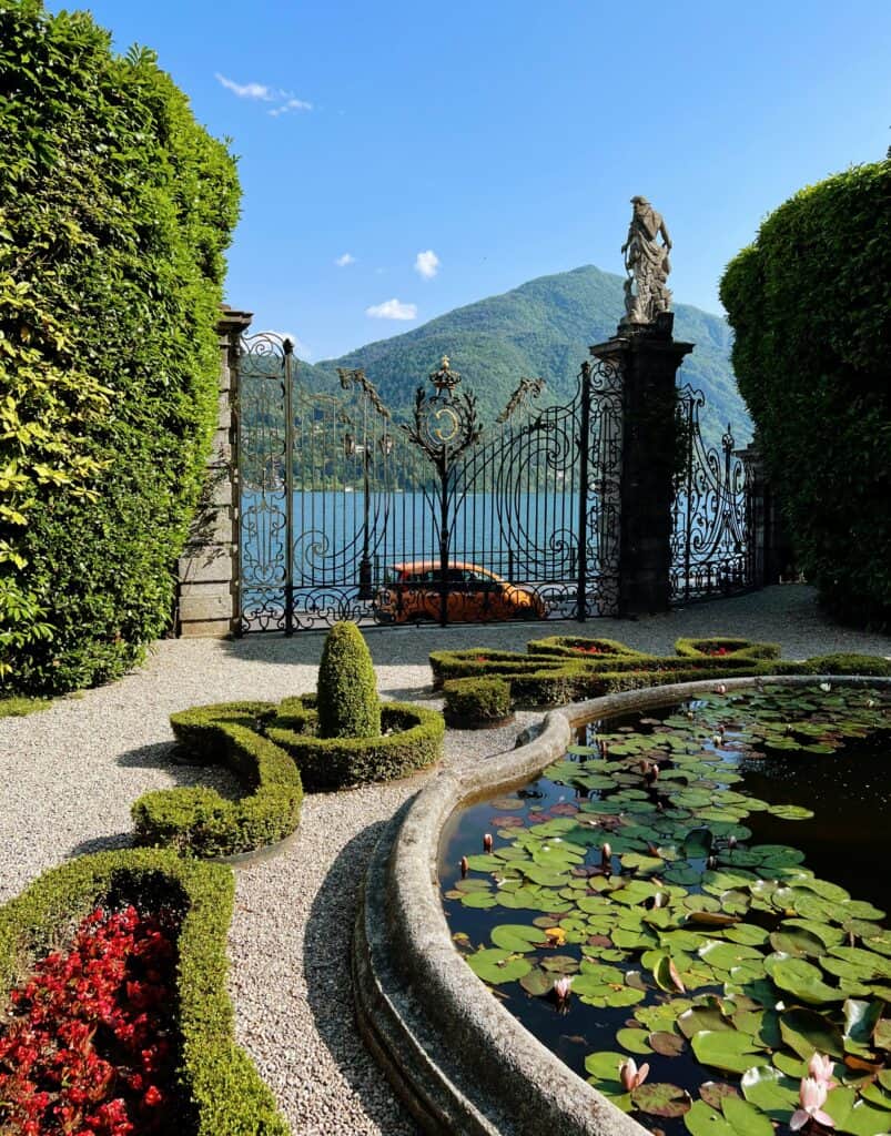 Villa Carlotta Lake Como Garden Gate With Statue And Lilly Lad Pond Ornamental Hedges