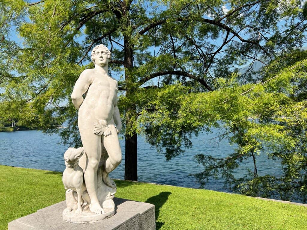 Lake Como Bellagio Villa Melzi Classical Roman Statue Greek God And Dog Lakeside With Trees