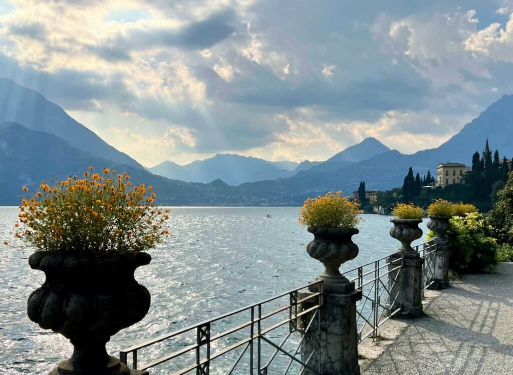 Villa Monastero Lake Como Lakeside Path With Ornamental Flower Pots Mountains Dramatic Light