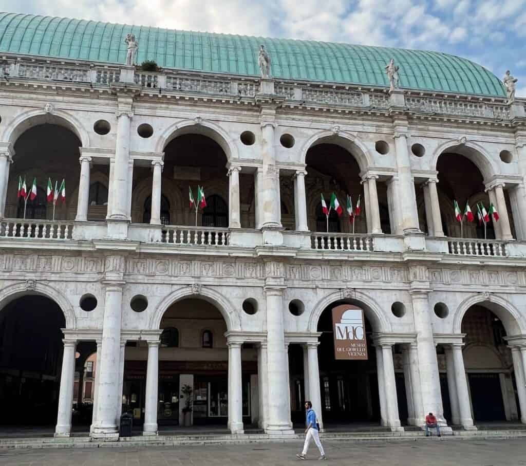 Palladio Vicenza Basilica Palladiana Exterior Loggia With Italian Flags Man Walking