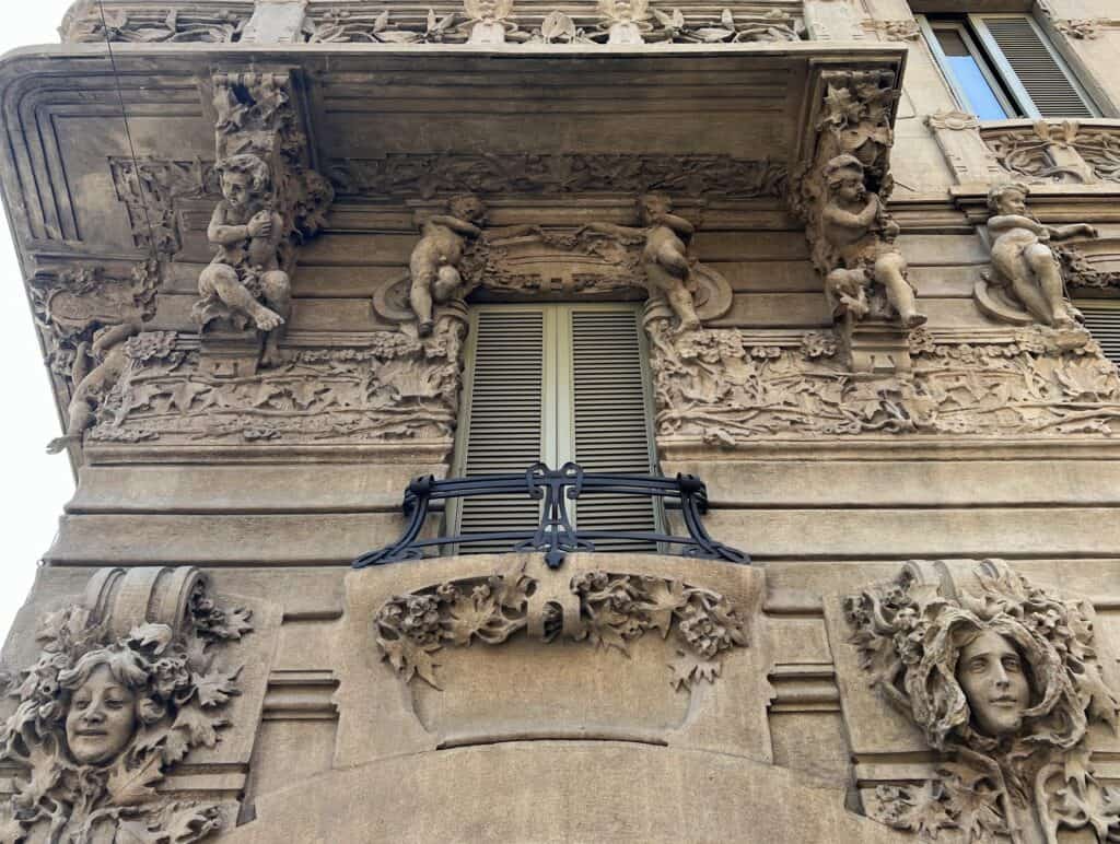 Milan Casa Guazzoni Art Nouveau Exterior Facade With Stone Carvings Babies And Smiling Ladies Italian Liberty Architecture