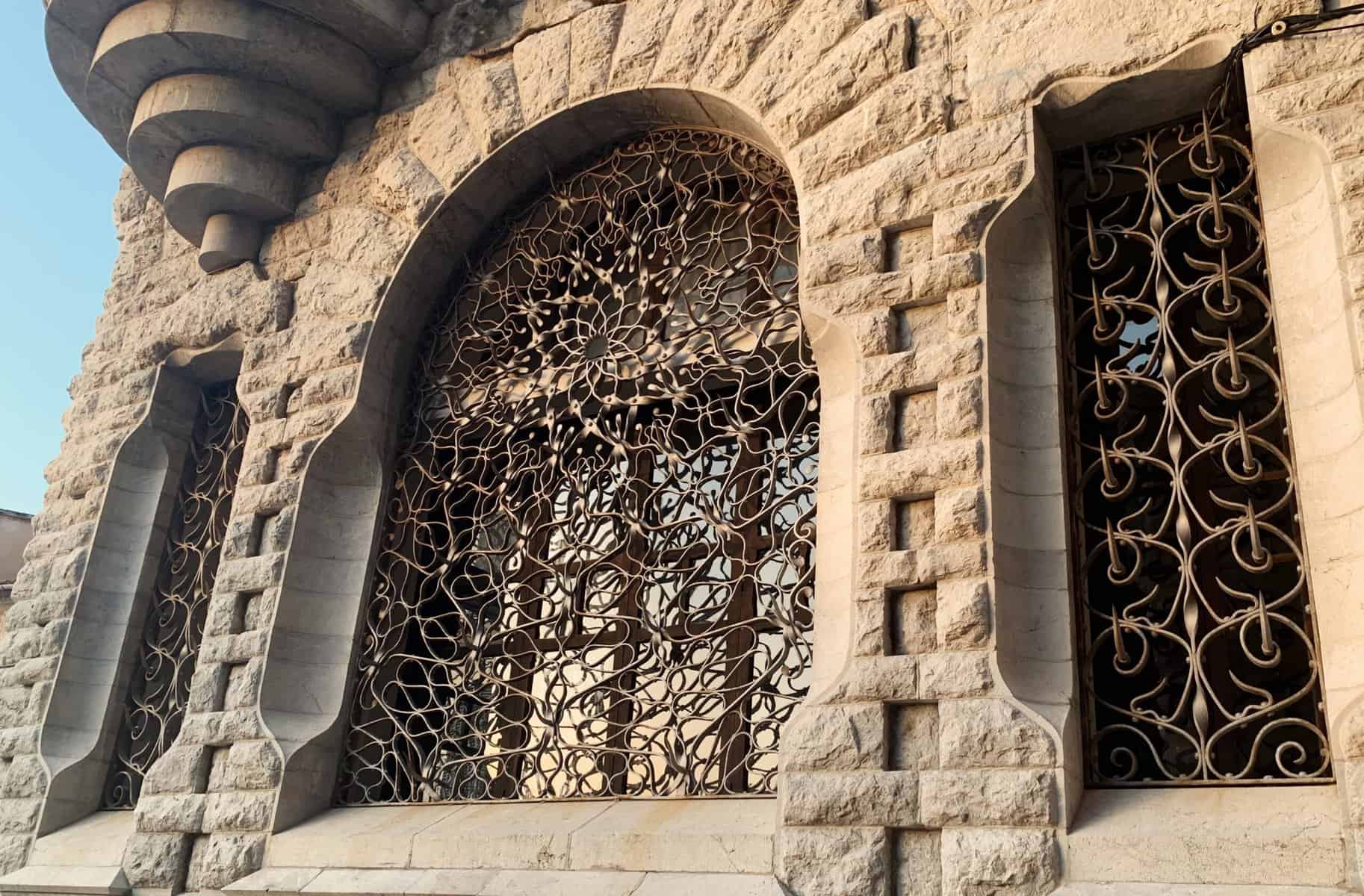 Soller Mallorca Bank Art Nouveau Architecture Stone Building Exterior With Ornate Iron Window Grille And Arches