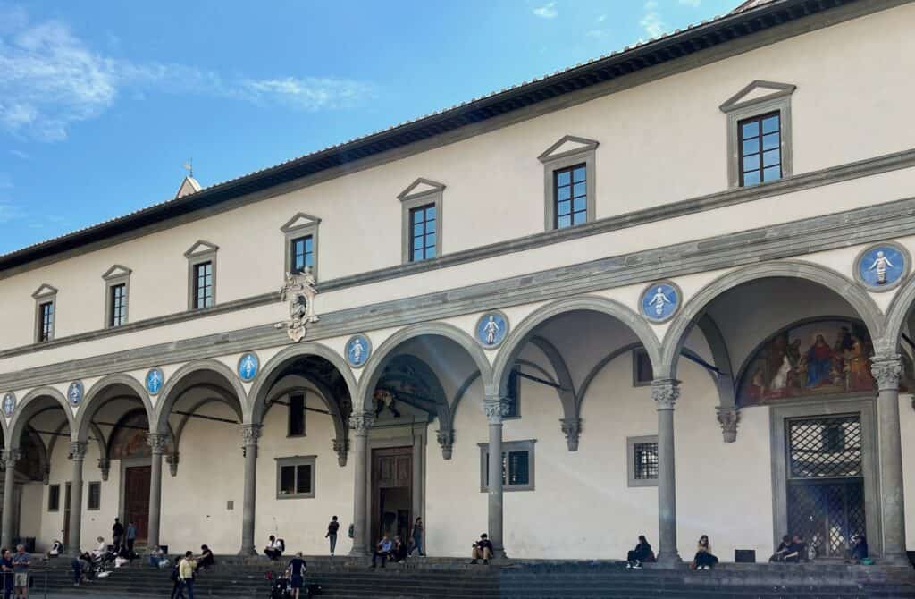 Brunelleschi Hospital Of The Innocents Loggia Columns And Arches With Pedestrians Florence Renaissance Architecture
