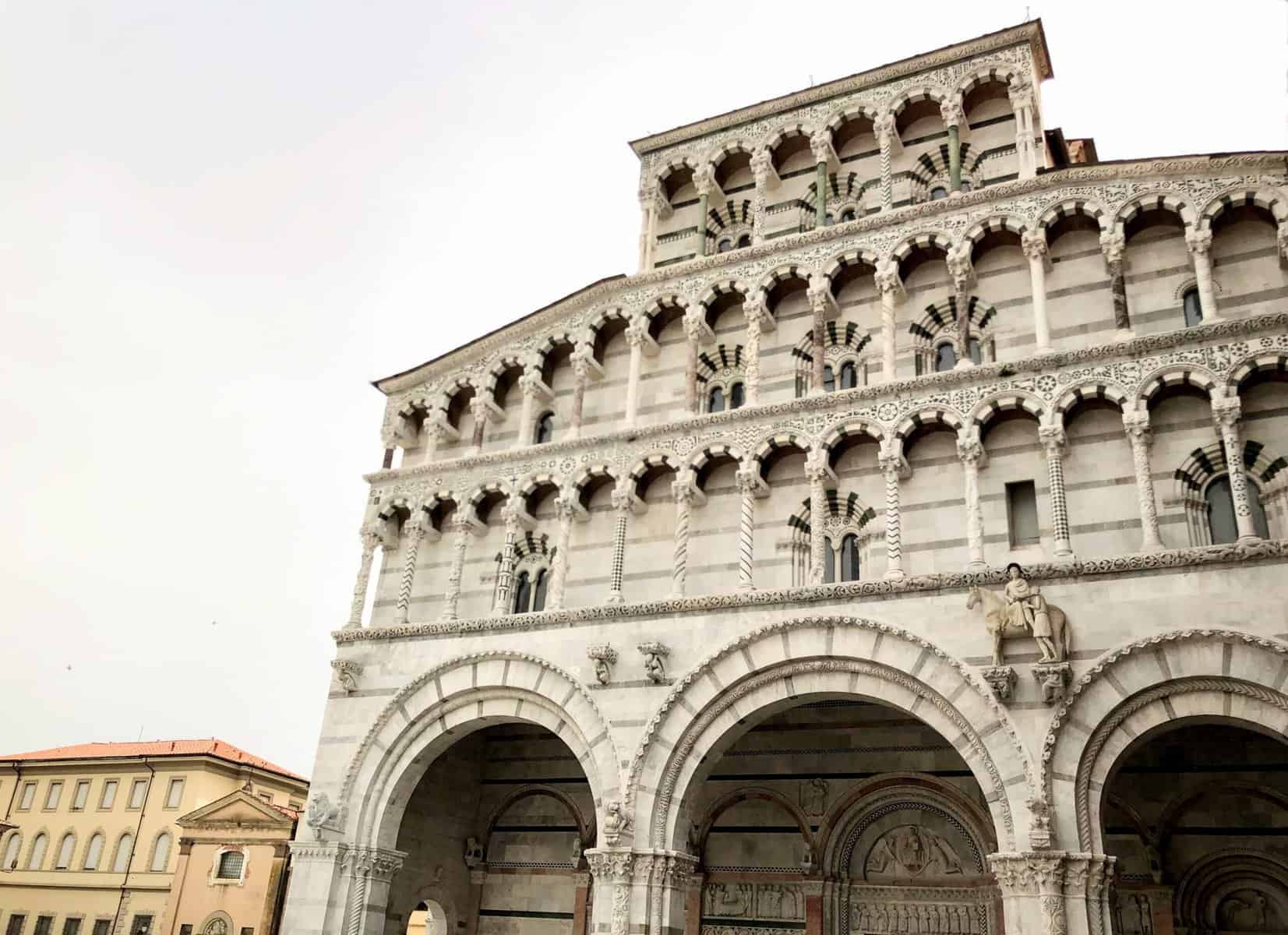 Lucca San Martino Cathedral Romanesque Facade White Marble With Large Arches Sculptures And Carvings