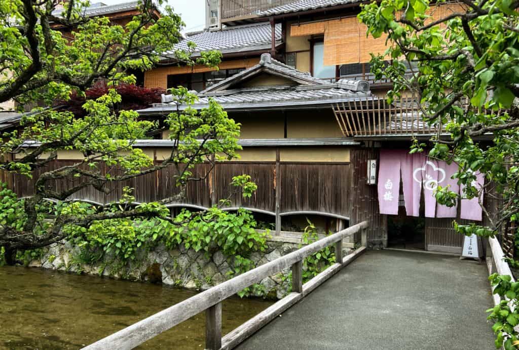 Wooden Houses With Bridge Over Canal Trees And Doorway Awning Shimbashi Geisha District Gion Kyoto